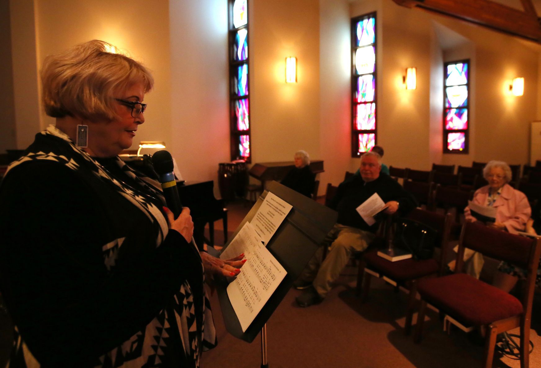 Sandra McKee leads people through a breathing exercise
